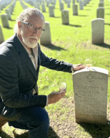 Brad Halling at grave of Timothy L. Martin